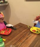 two kids wearing fruit crown