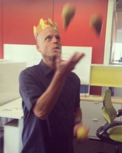 man juggling pears
